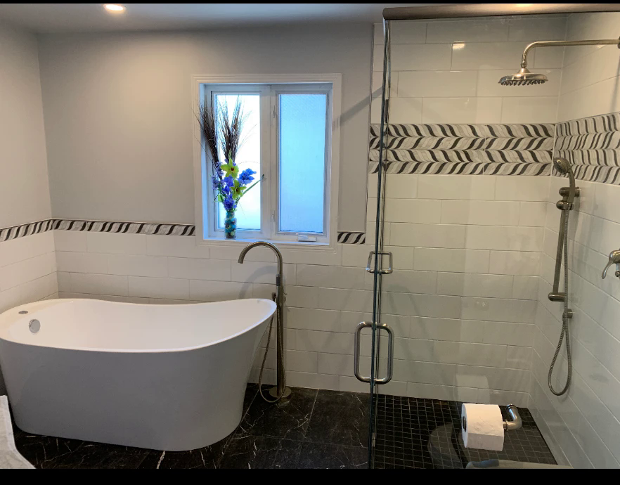 Bathroom renovation — finished tub and glass shower enclosure